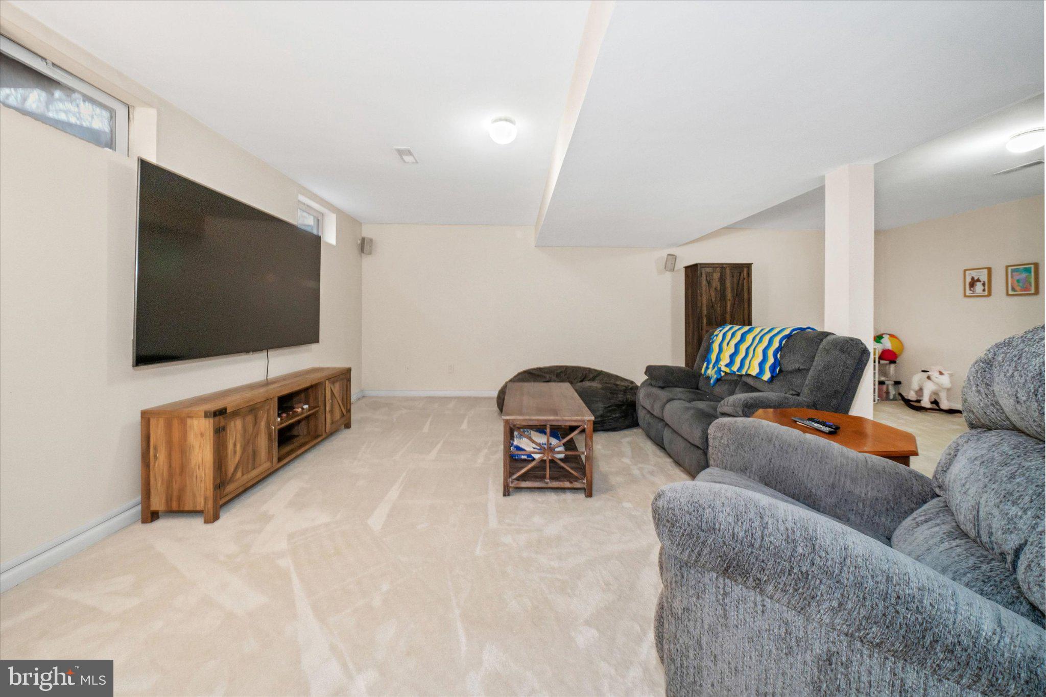 457 Preakness Run Newark, DE 19702 - Photo 52 of 55 a living room with furniture and a flat screen tv