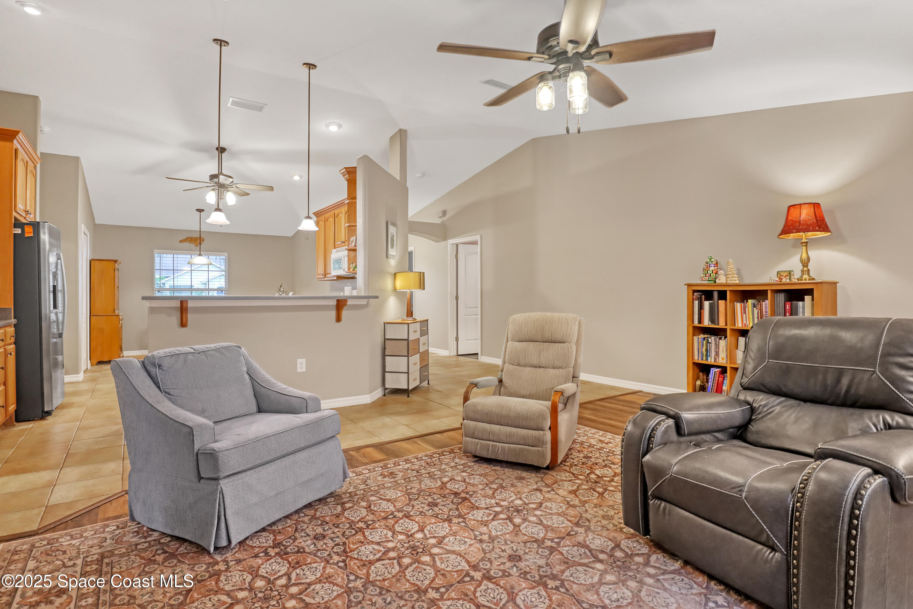 1081 Meadowbrook Road Northeast Palm Bay, FL 32905 - Photo 11 of 37 Family room and kitchen