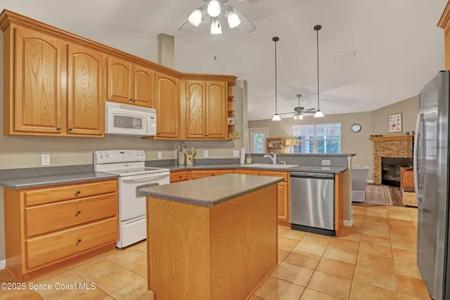 a bathroom with a shower sink and mirror