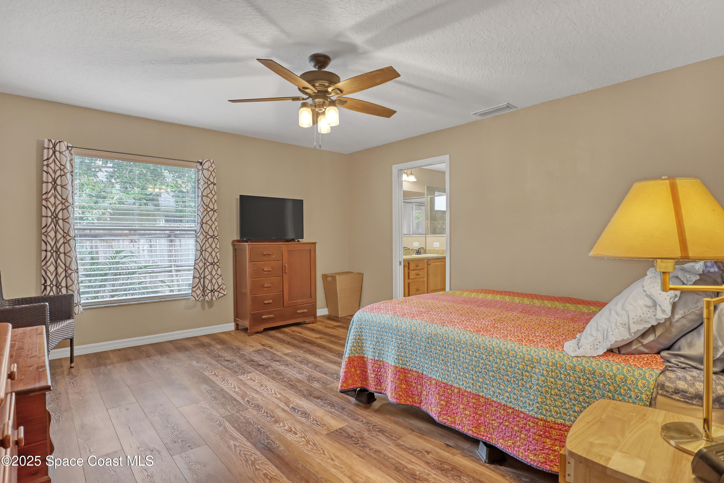 1081 Meadowbrook Road Northeast Palm Bay, FL 32905 - Photo 17 of 37 Primary bedroom