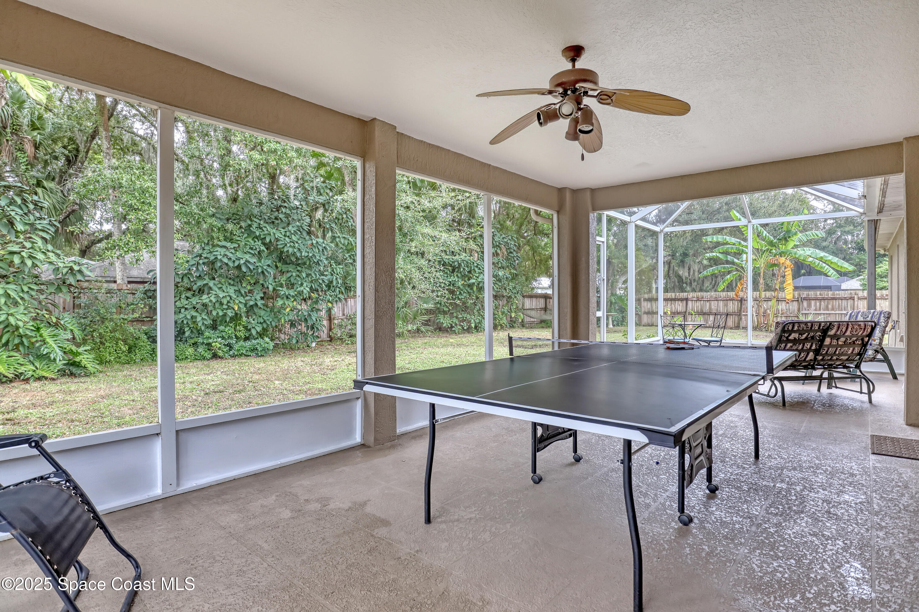 1081 Meadowbrook Road Northeast Palm Bay, FL 32905 - Photo 28 of 38 Large screened porch