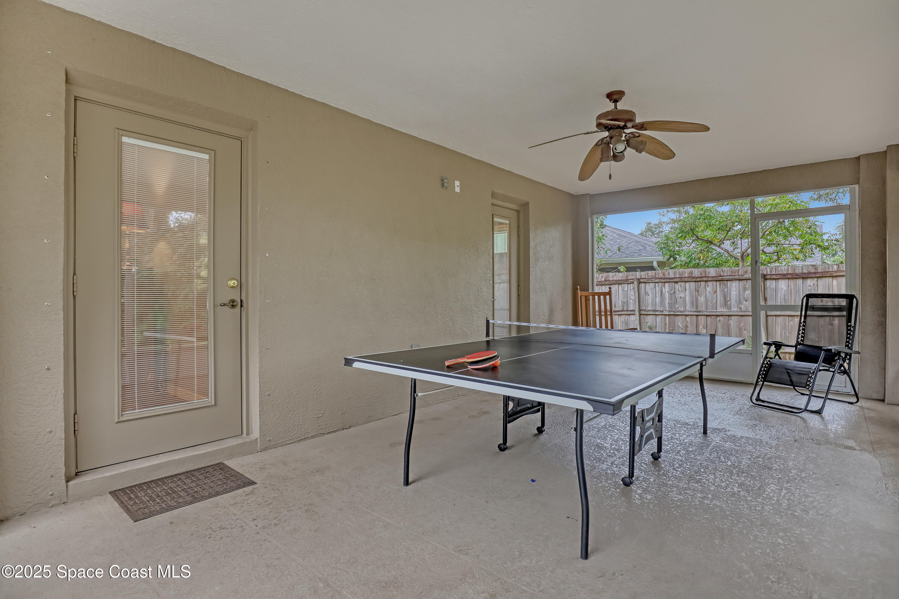 1081 Meadowbrook Road Northeast Palm Bay, FL 32905 - Photo 29 of 38 Screend porch with door to family room a