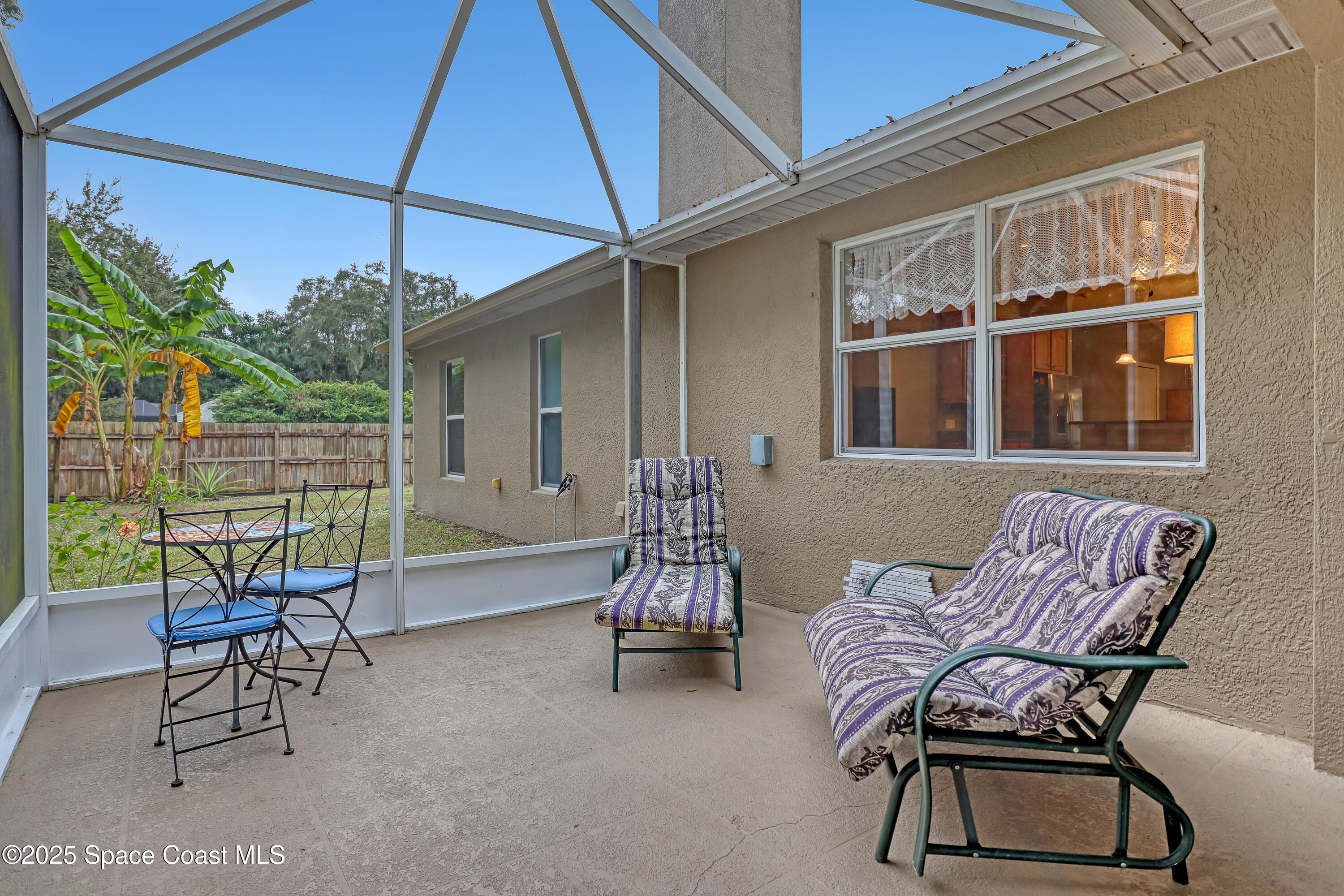 1081 Meadowbrook Road Northeast Palm Bay, FL 32905 - Photo 30 of 38 Screened porch - sunny area