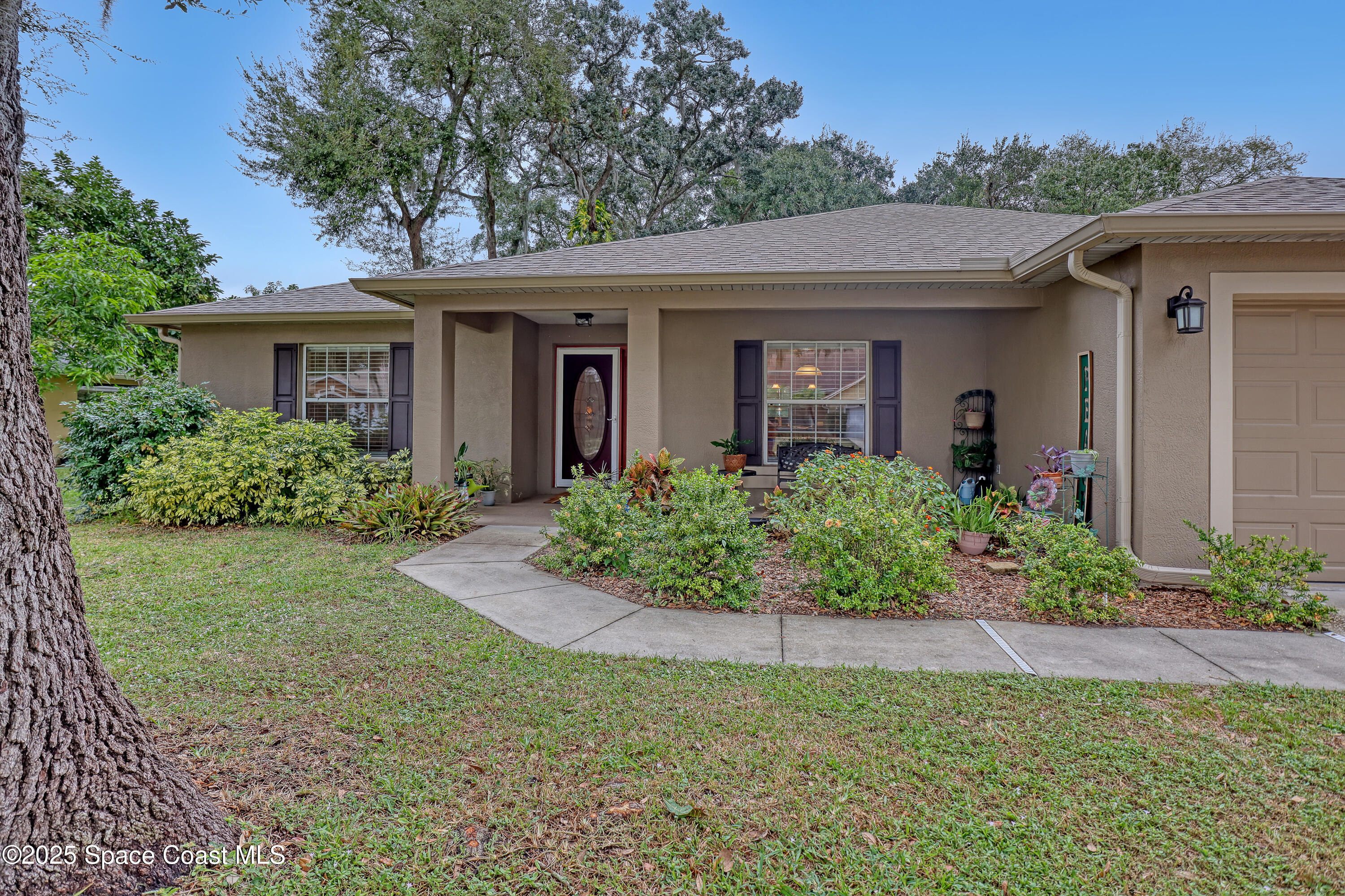 1081 Meadowbrook Road Northeast Palm Bay, FL 32905 - Photo 3 of 38 1081 Meadowbrook front entry