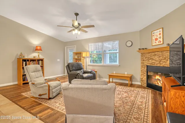 a kitchen with stainless steel appliances granite countertop a sink a stove and a wooden cabinets