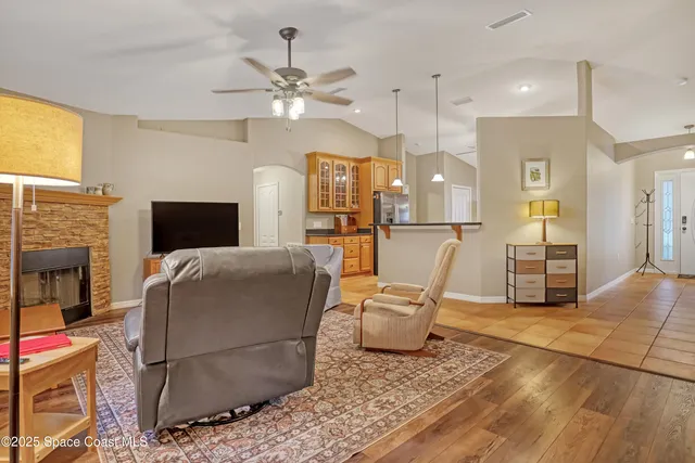 a dining room that has a chandelier and a table in it