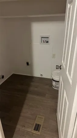 a view of a livingroom with wooden floor