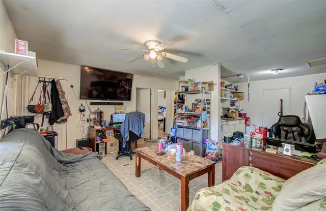 a room with furniture and a flat screen tv