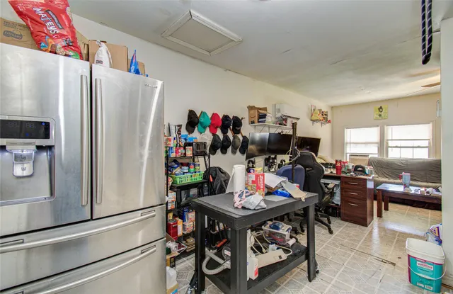 a view of a dining room with furniture and a chandelier