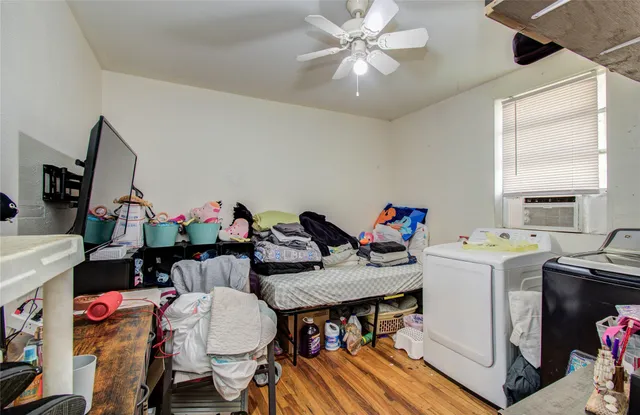 a view of a dining room with furniture and a chandelier