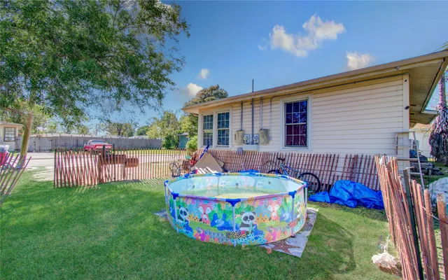 a front view of house with yard and outdoor seating