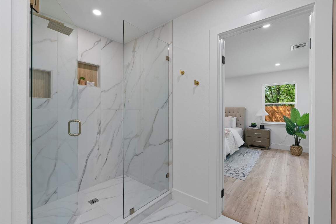 5604 Overbrook Drive Austin, TX 78723 - Photo 26 of 34 a bathroom with a shower and a toilet