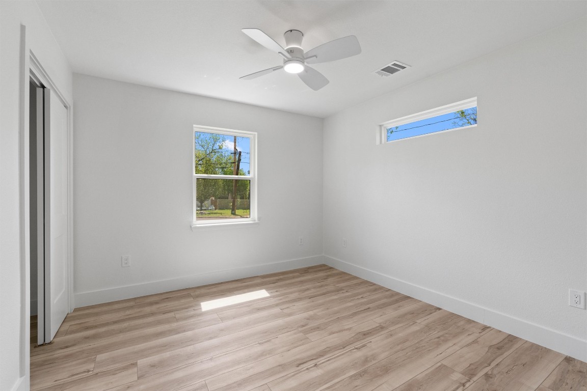 5604 Overbrook Drive Austin, TX 78723 - Photo 27 of 34 wooden floor in an empty room with a window
