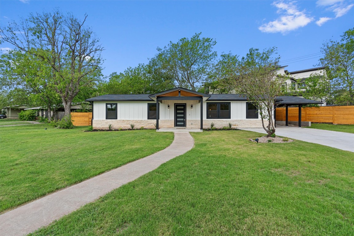5604 Overbrook Drive Austin, TX 78723 - Photo 5 of 34 a front view of house with a garden and trees
