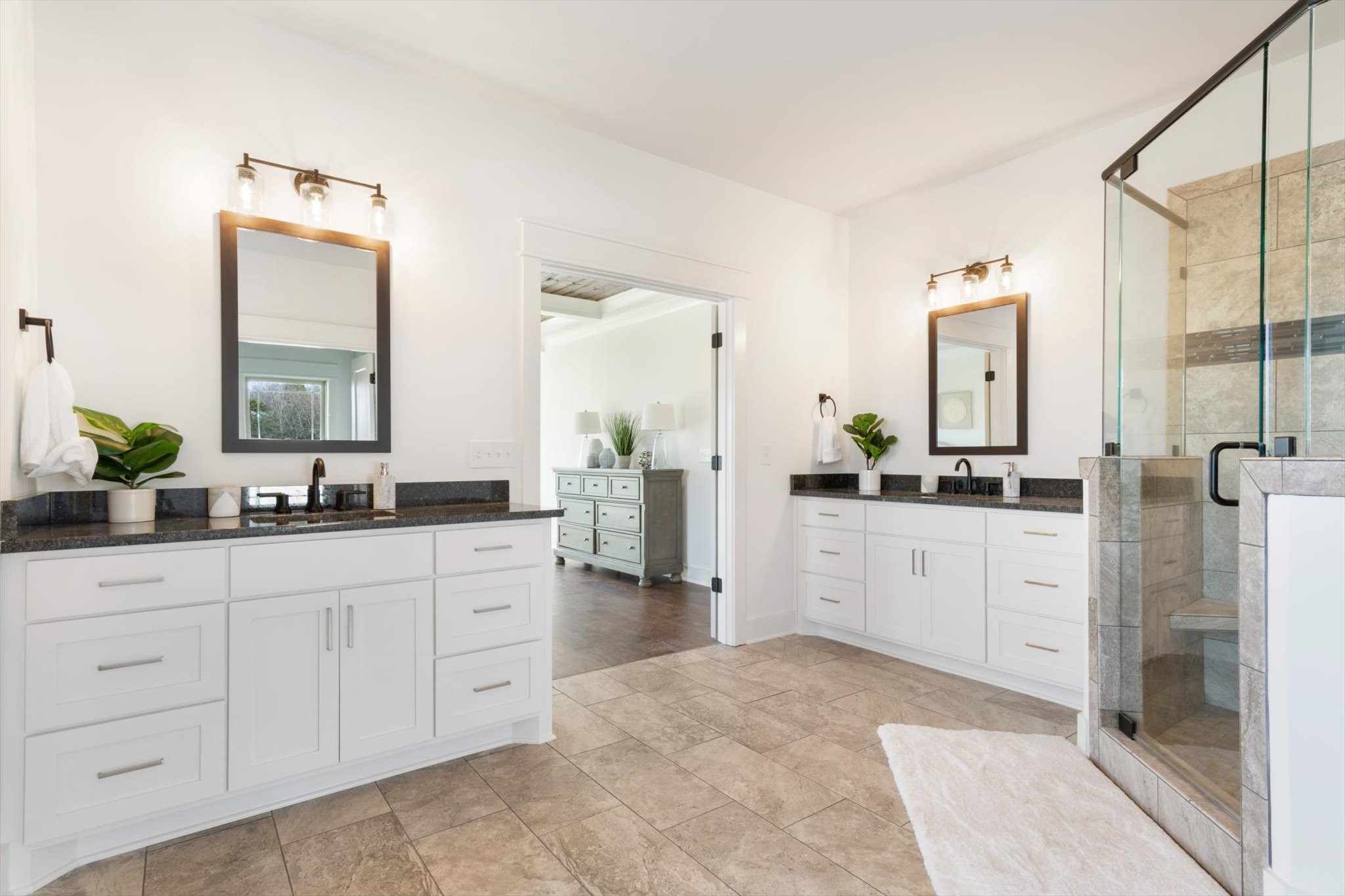 2704 Carousel Drive Murfreesboro, TN 37128 - Photo 11 of 17 a spacious bathroom with a double vanity sink a mirror a window and a bathtub