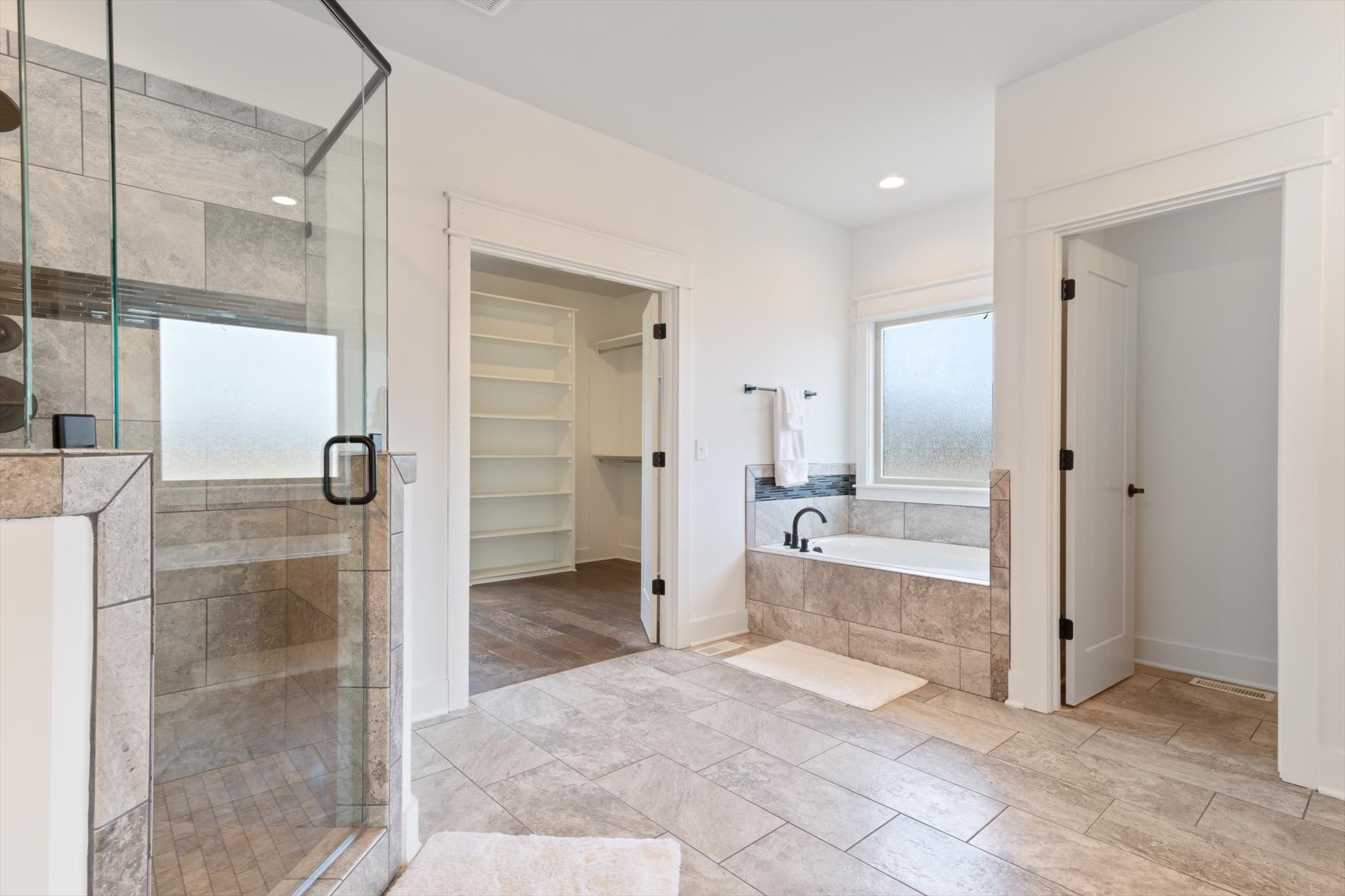 2704 Carousel Drive Murfreesboro, TN 37128 - Photo 10 of 17 a bathroom with a glass shower door mirror and shower