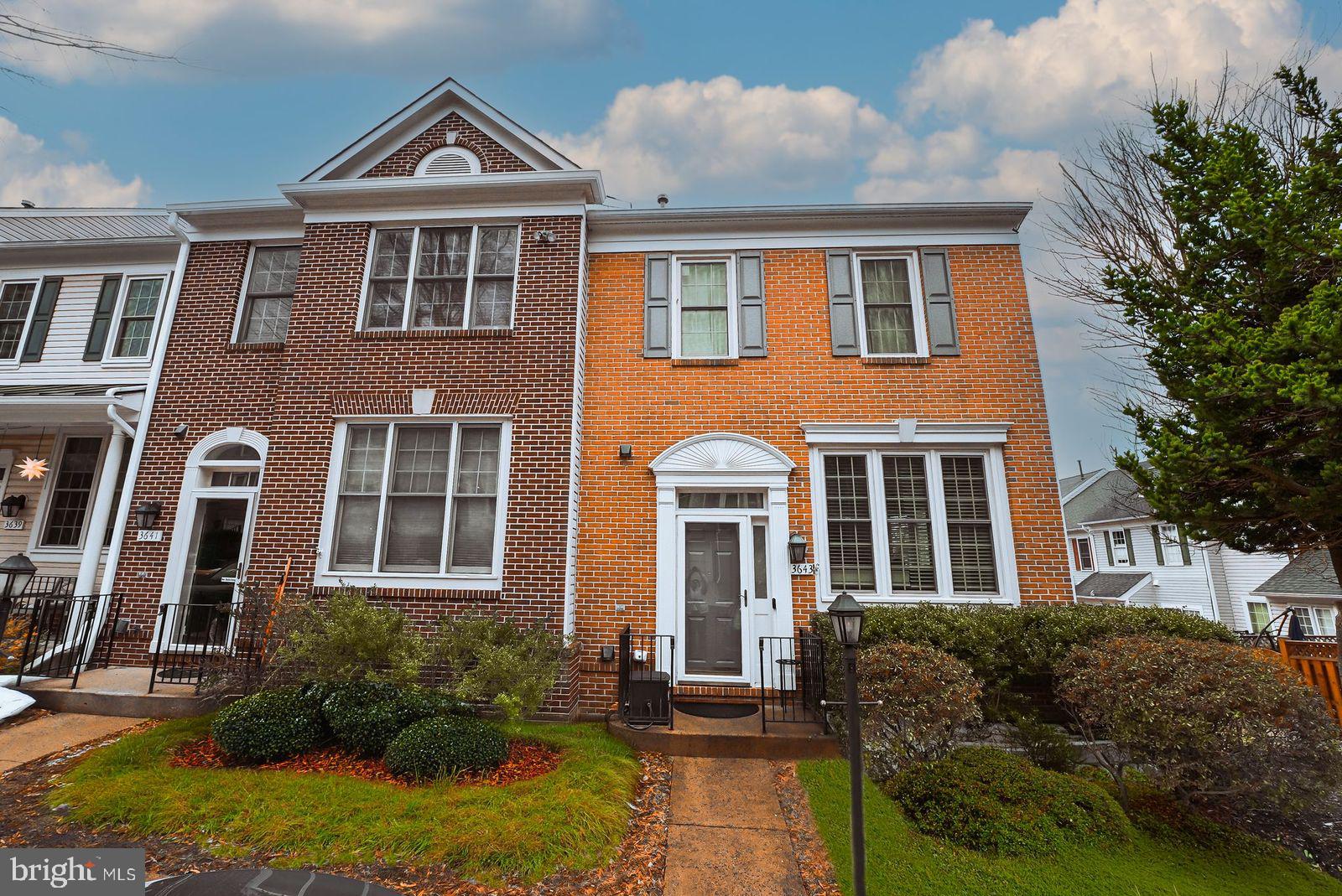 3643 Ransom Place Alexandria, VA 22306 - Photo 2 of 13 a front view of a house with yard and green space