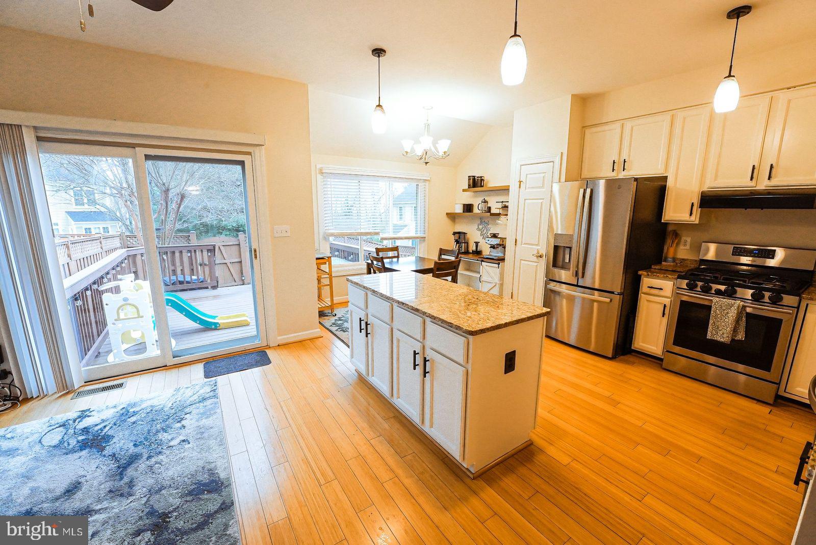 3643 Ransom Place Alexandria, VA 22306 - Photo 4 of 13 a kitchen with stainless steel appliances a stove a sink and a refrigerator