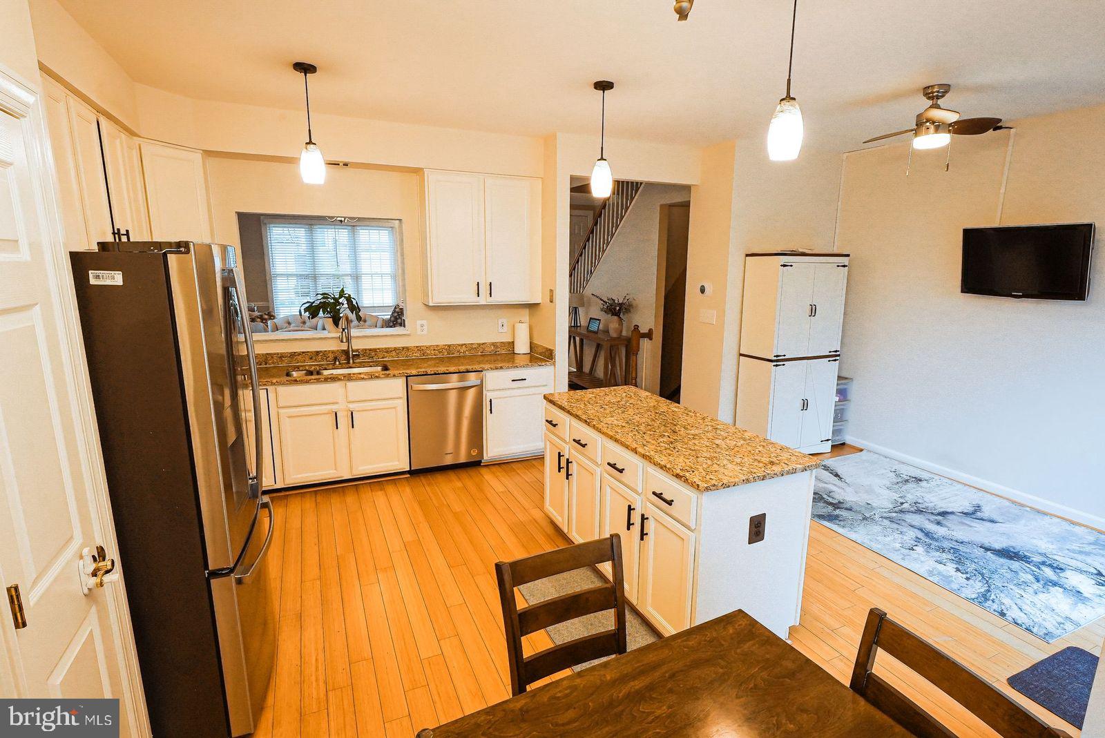 3643 Ransom Place Alexandria, VA 22306 - Photo 5 of 13 a kitchen with stainless steel appliances granite countertop a refrigerator a stove and white cabinets