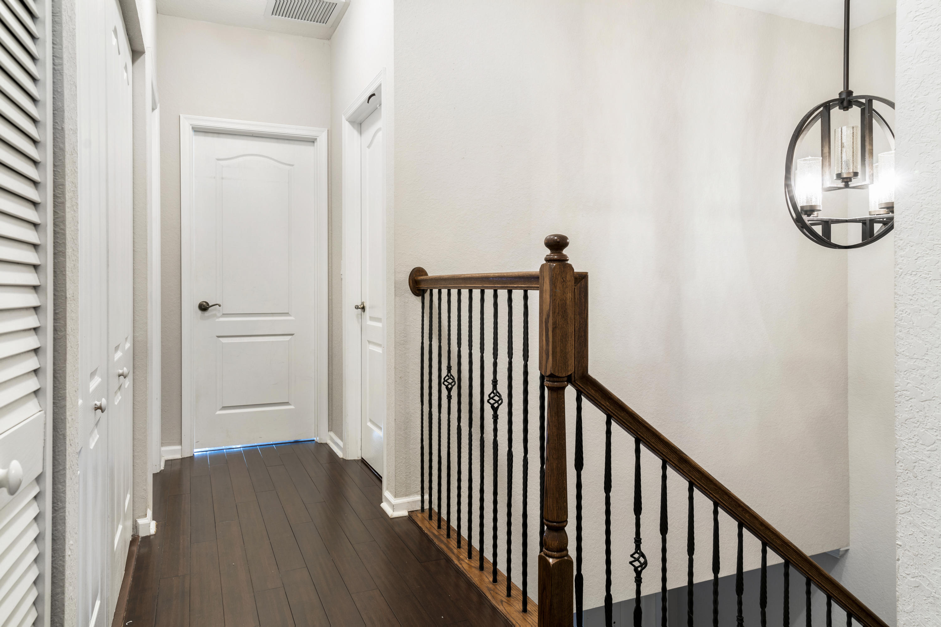 4719 North Prive Circle Delray Beach, FL 33445 - Photo 12 of 23 a view of a hallway with wooden floor