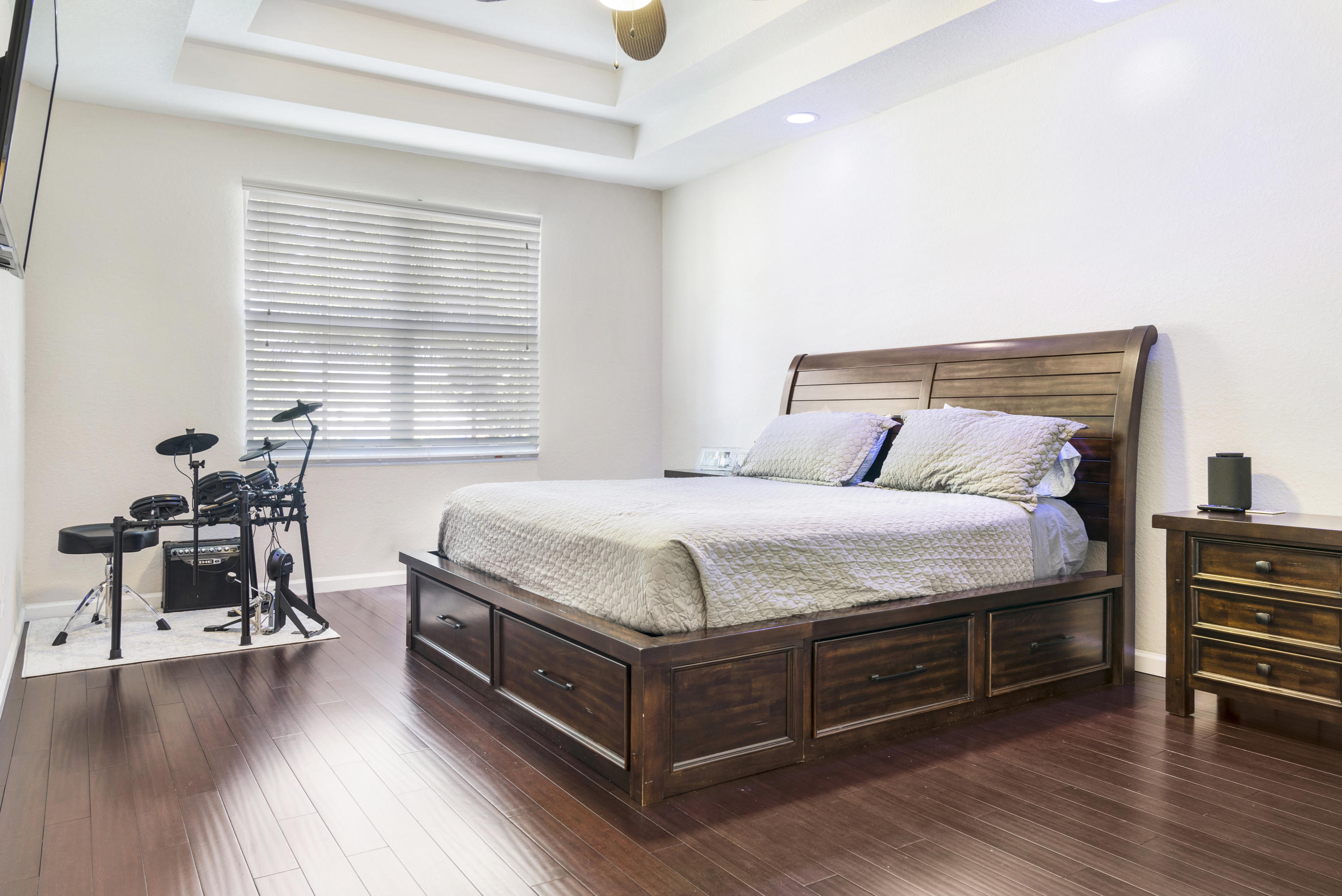 4719 North Prive Circle Delray Beach, FL 33445 - Photo 13 of 23 a bedroom with a bed a table and chair