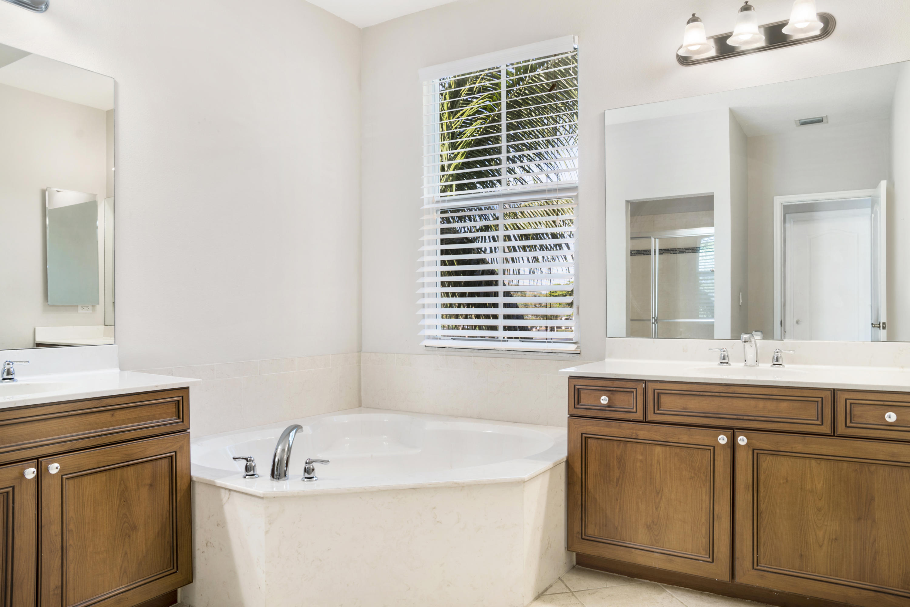 4719 North Prive Circle Delray Beach, FL 33445 - Photo 15 of 23 a bath room with a sink and a mirror