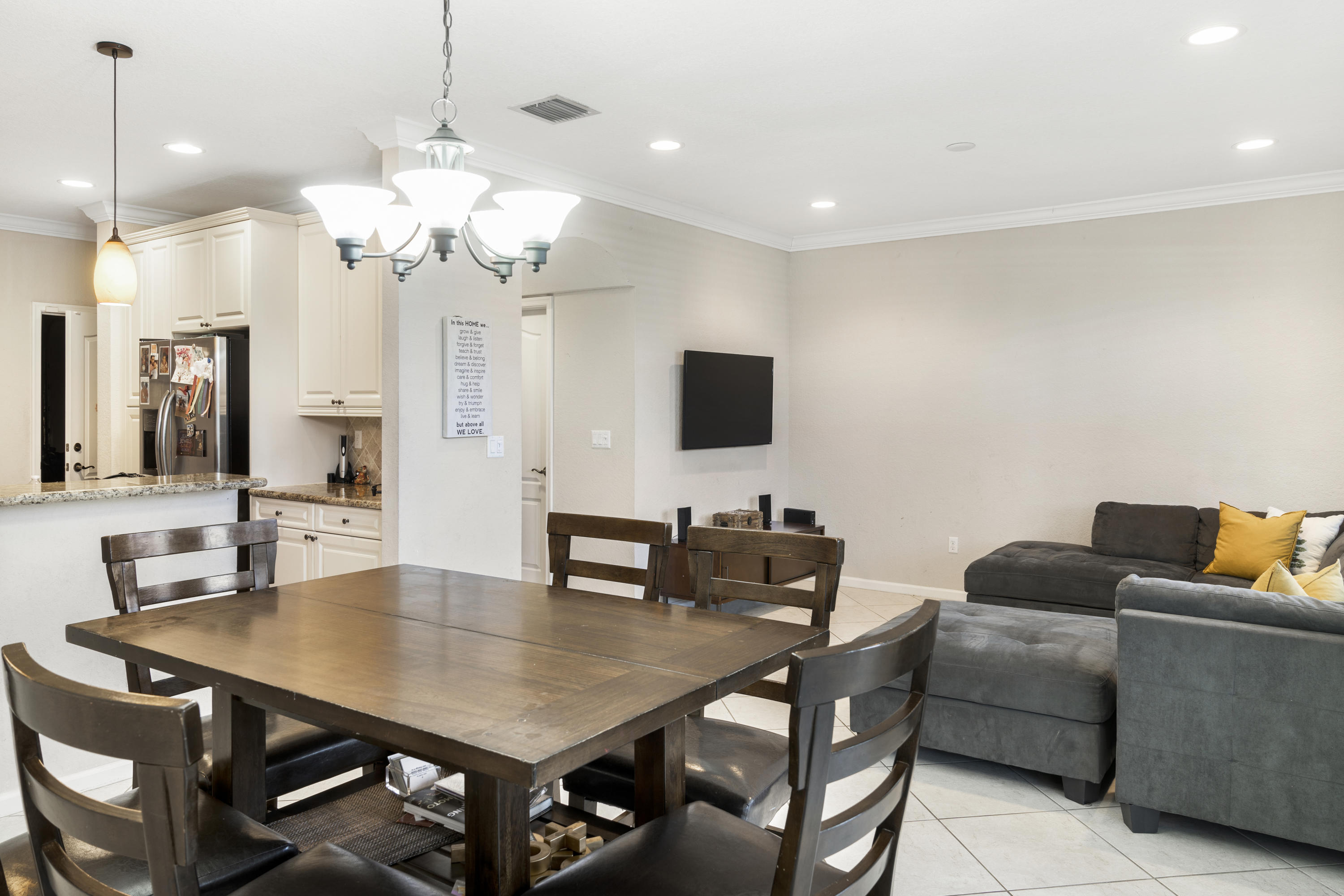 4719 North Prive Circle Delray Beach, FL 33445 - Photo 7 of 23 a view of a dining room with furniture and wooden floor