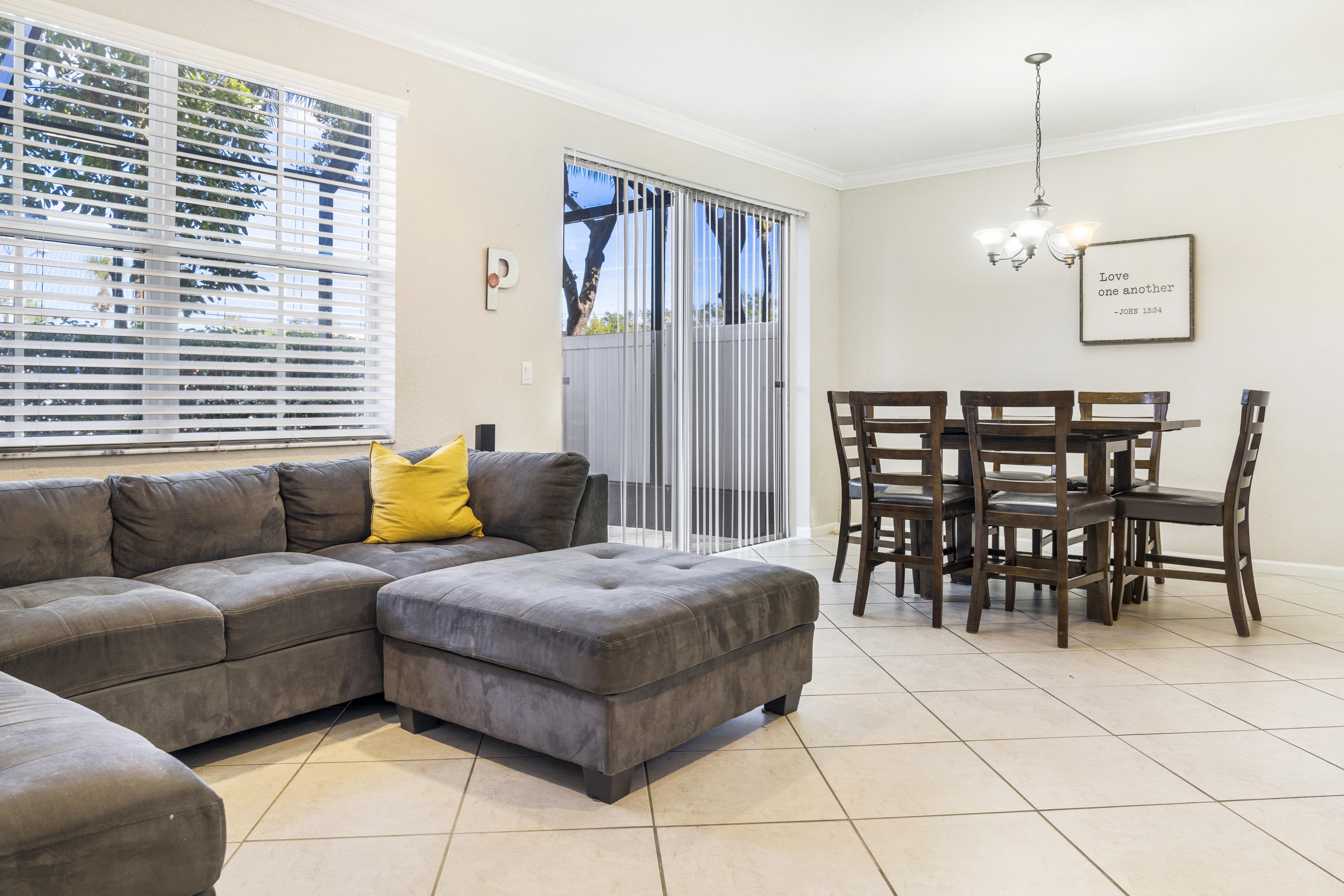 4719 North Prive Circle Delray Beach, FL 33445 - Photo 9 of 23 a living room with furniture a dining table and a window