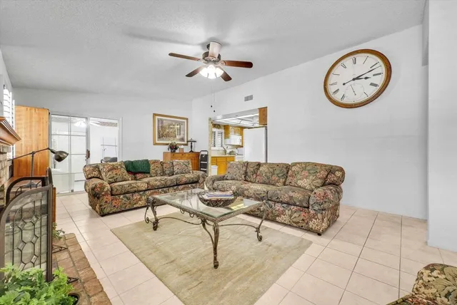 a kitchen with granite countertop cabinets and white appliances