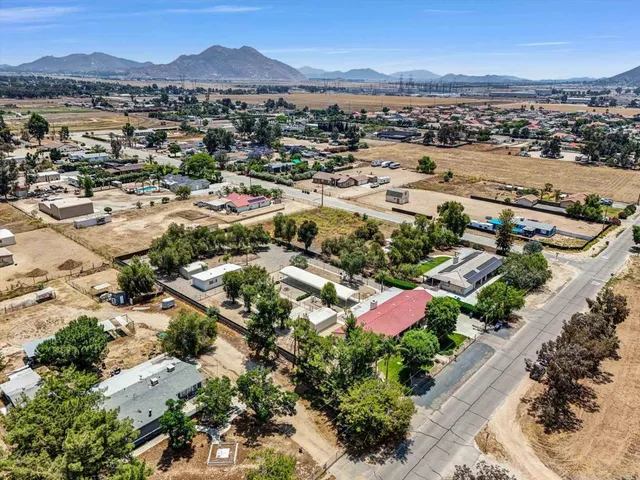 an aerial view of residential houses with outdoor space