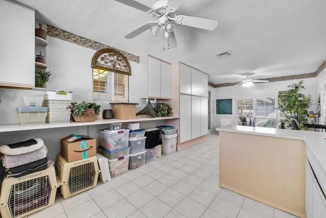 a kitchen with sink cabinets and window
