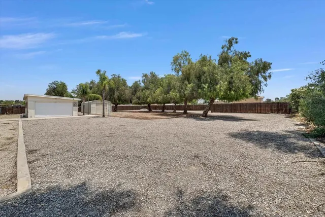 an outdoor space with wooden fence