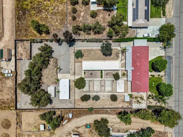 an aerial view of residential houses with outdoor space