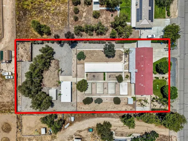 an aerial view of residential houses and outdoor space