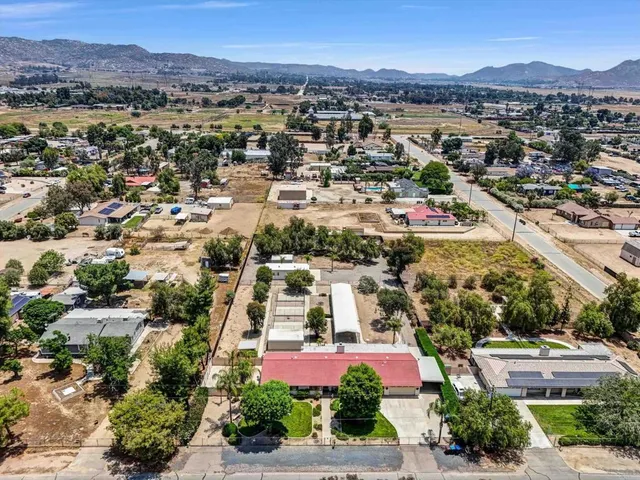 an aerial view of residential houses and outdoor space