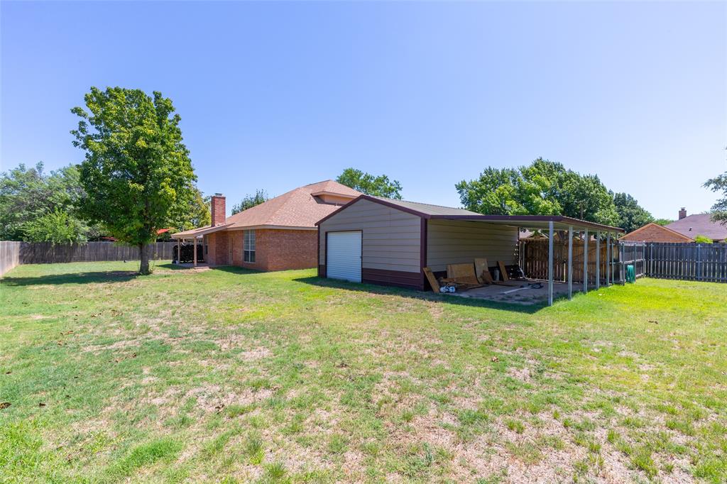 1026 Reeves Street Abilene, TX 79602 - Photo 33 of 38 Workshop is 19 x 24, 2 roll up doors, covered parking or covered patio.