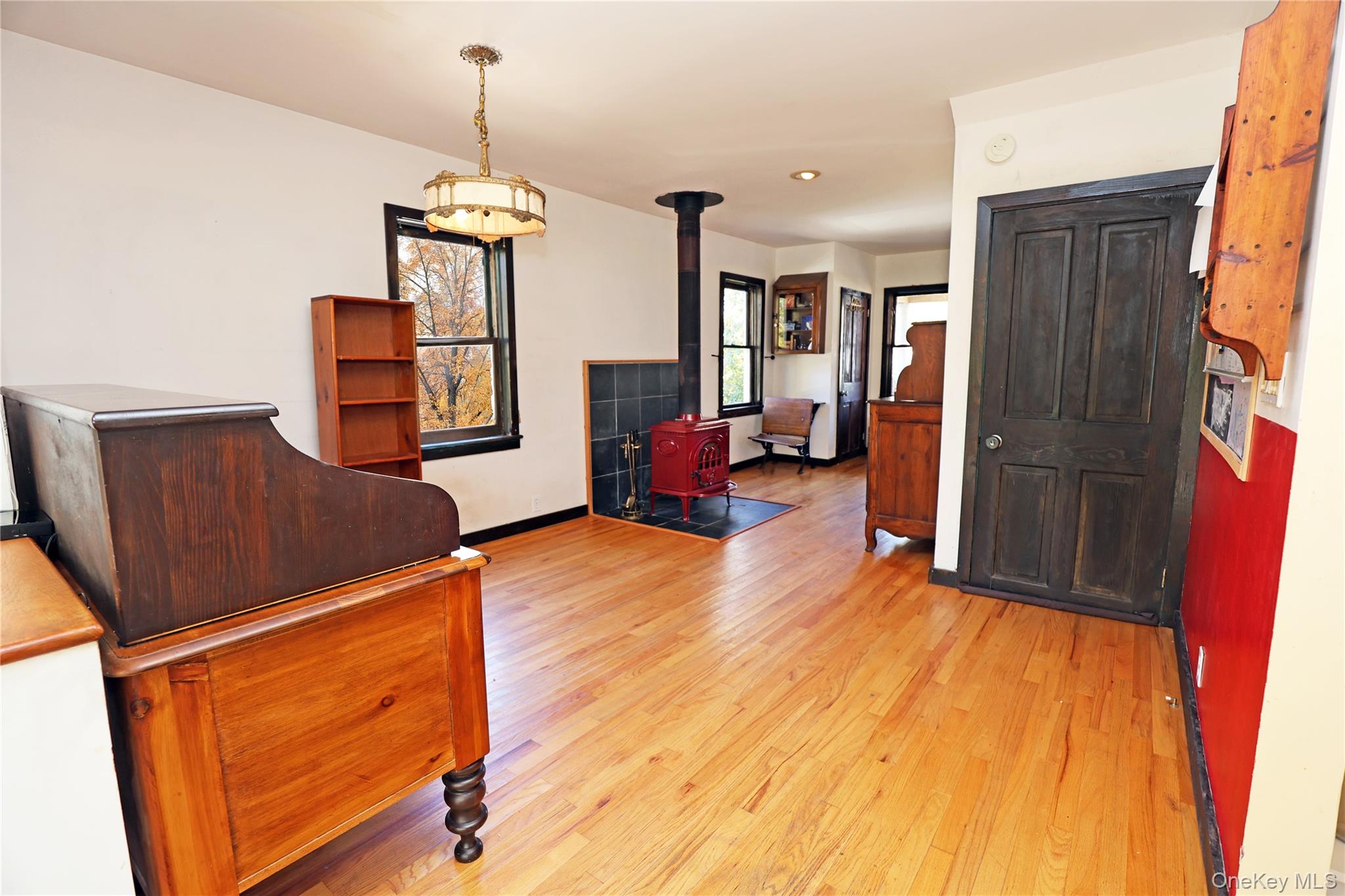 92 Hughson Road Carmel, NY 10512 - Photo 15 of 42 Family room/office space with a wood stove and light wood-style flooring