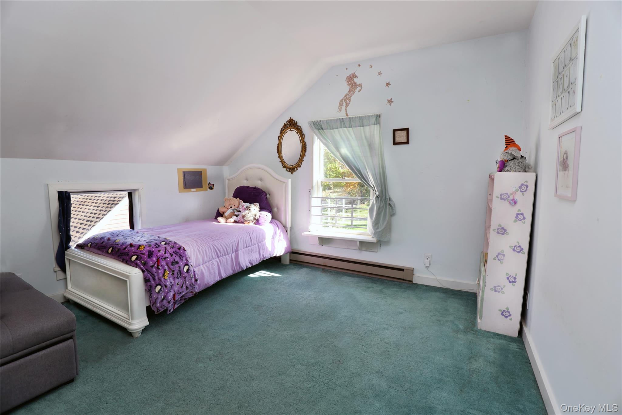 92 Hughson Road Carmel, NY 10512 - Photo 22 of 42 Bedroom featuring lofted ceiling, baseboard heating, and carpet flooring