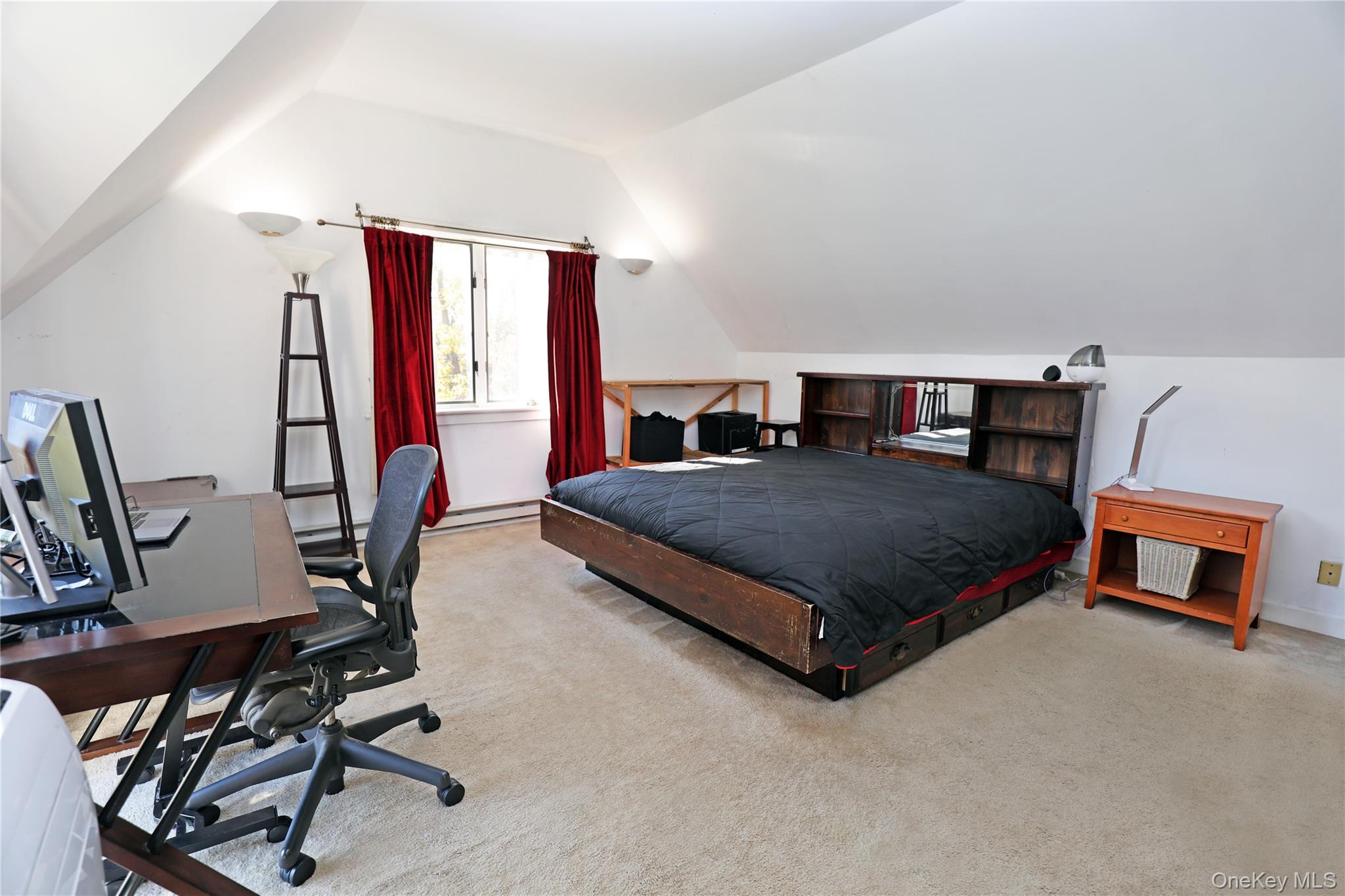 92 Hughson Road Carmel, NY 10512 - Photo 29 of 42 Carpeted bedroom with lofted ceiling, an office area, and a baseboard radiator