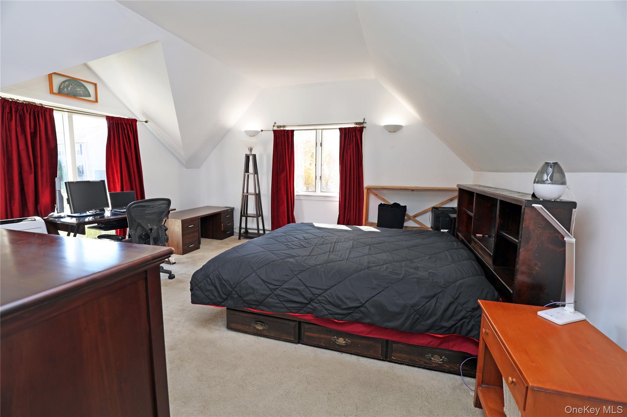 92 Hughson Road Carmel, NY 10512 - Photo 31 of 42 Bedroom with light colored carpet and vaulted ceiling