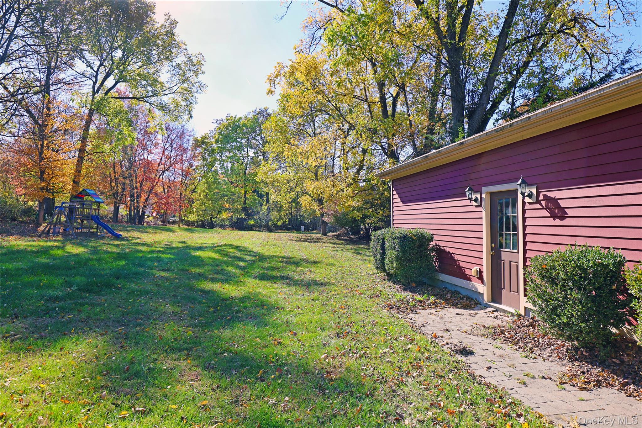 92 Hughson Road Carmel, NY 10512 - Photo 40 of 42 View of green lawn with a playground