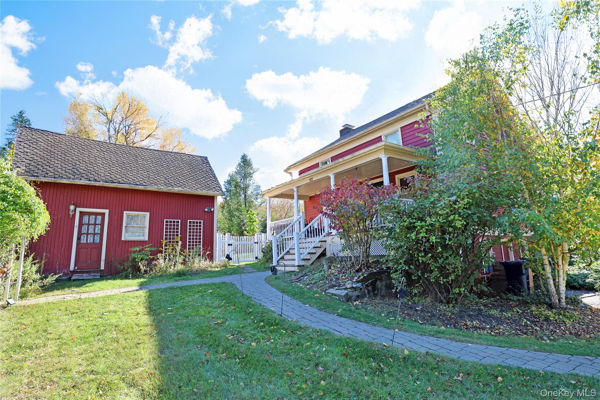 92 Hughson Road Carmel, NY 10512 - Photo 41 of 42 View of yard featuring an outdoor structure, stairway, and a porch
