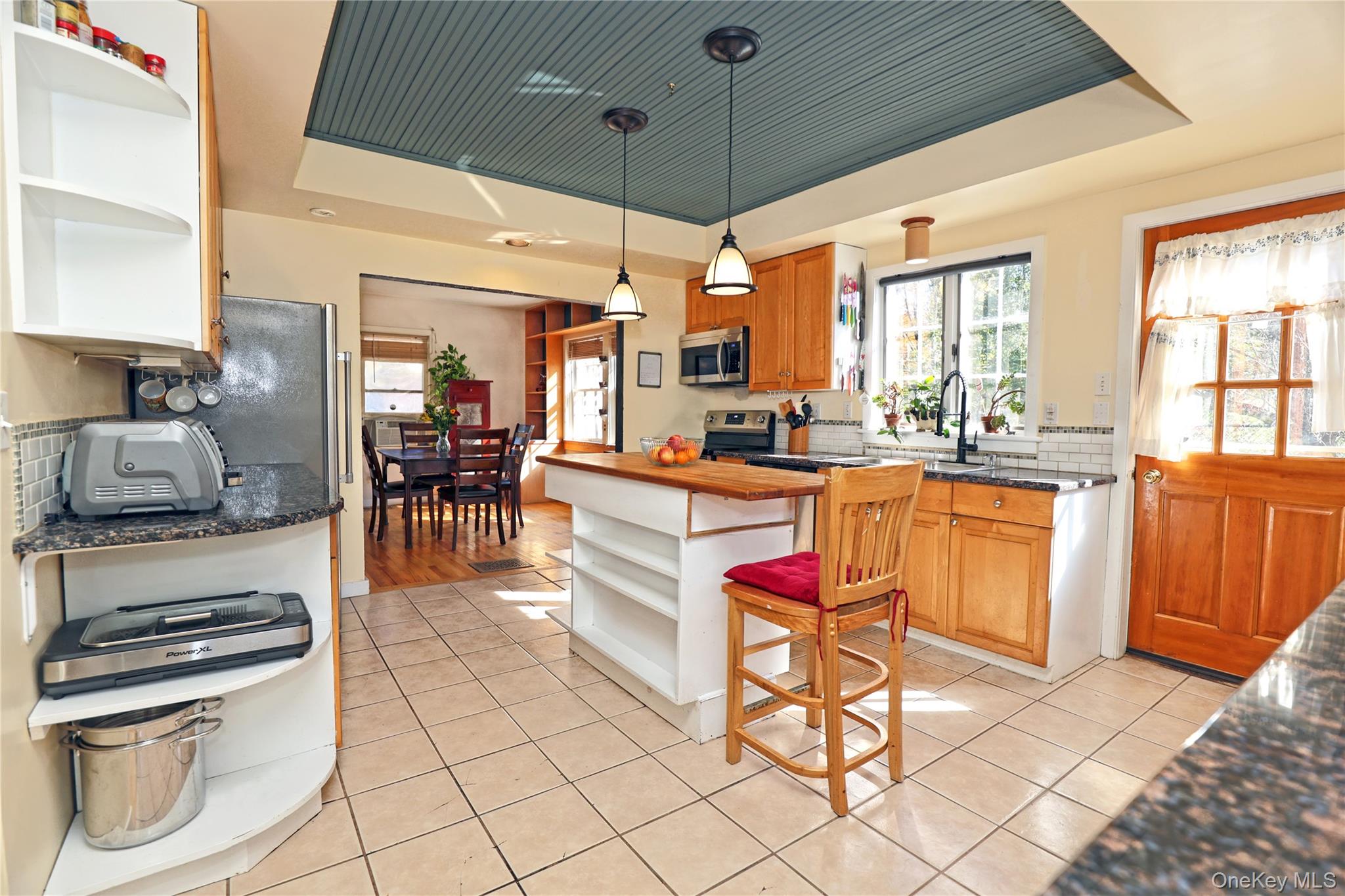 92 Hughson Road Carmel, NY 10512 - Photo 8 of 42 Kitchen with open shelves, decorative backsplash, pendant lighting, and dark stone counters