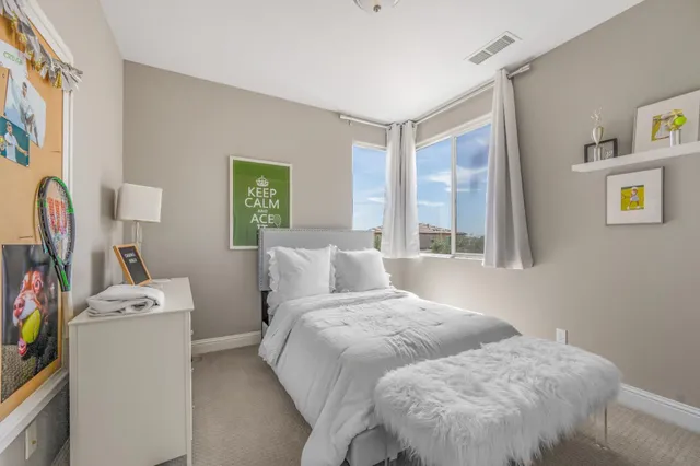 a bed room with a bed and a window