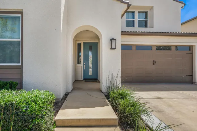 a front view of a house with a garage