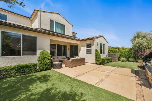 a view of a house with backyard and porch