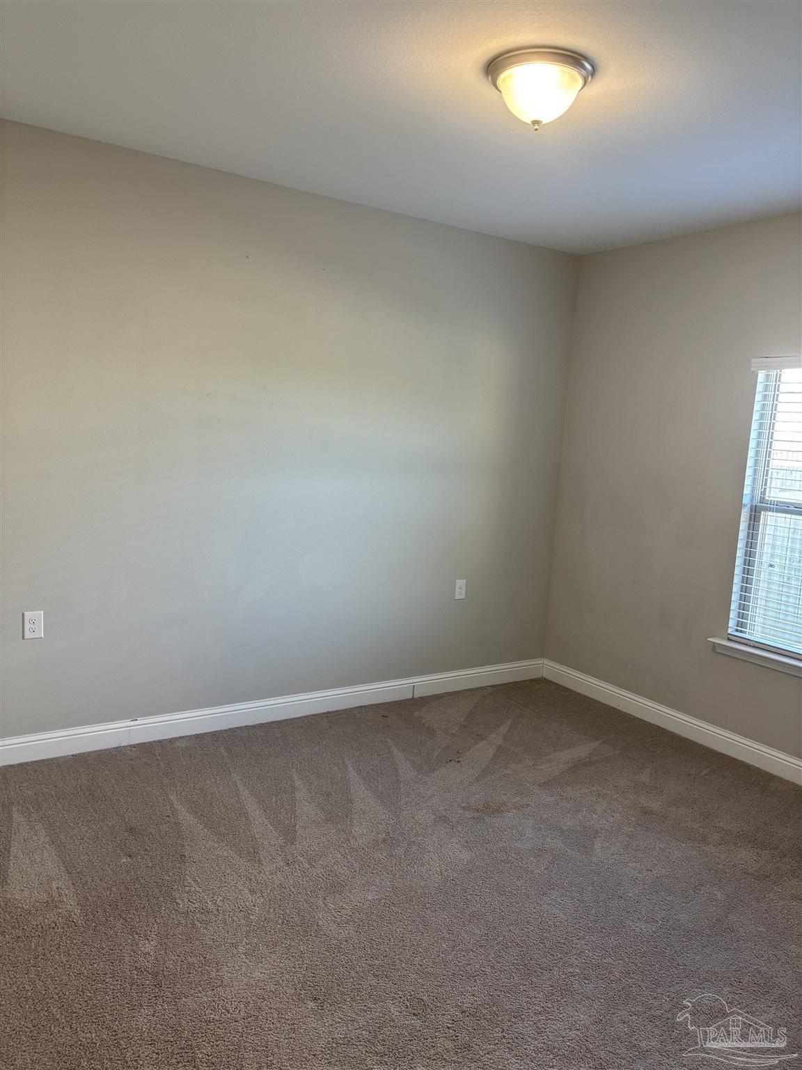 400 Broadleaf Circle Cantonment, FL 32533 - Photo 16 of 21 an empty room with a window