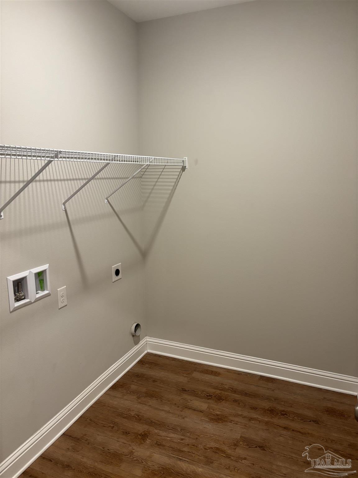 400 Broadleaf Circle Cantonment, FL 32533 - Photo 18 of 21 a view of a room with wooden floor and cabinet