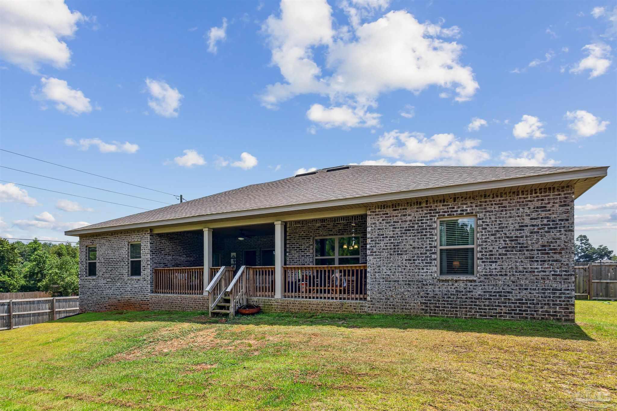 400 Broadleaf Circle Cantonment, FL 32533 - Photo 21 of 21 a view of a house with swimming pool and sitting area