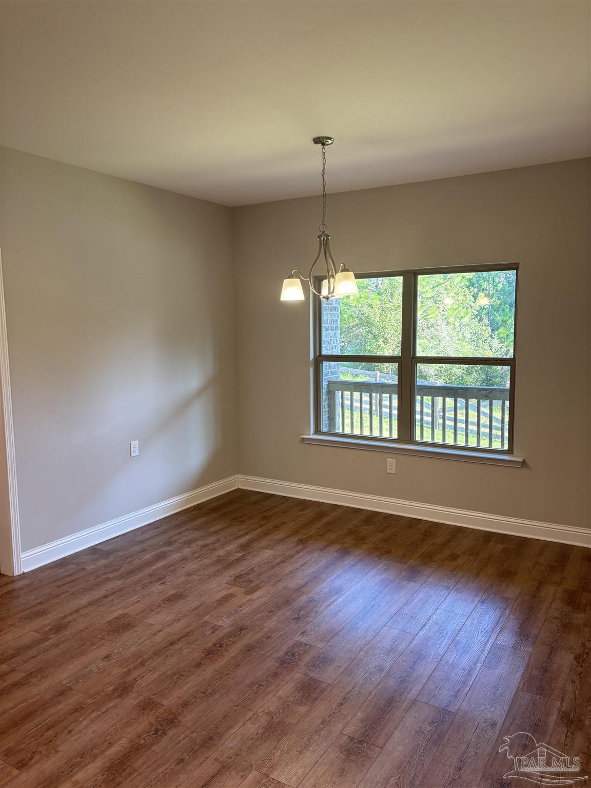 400 Broadleaf Circle Cantonment, FL 32533 - Photo 6 of 21 wooden floor in an empty room with a window